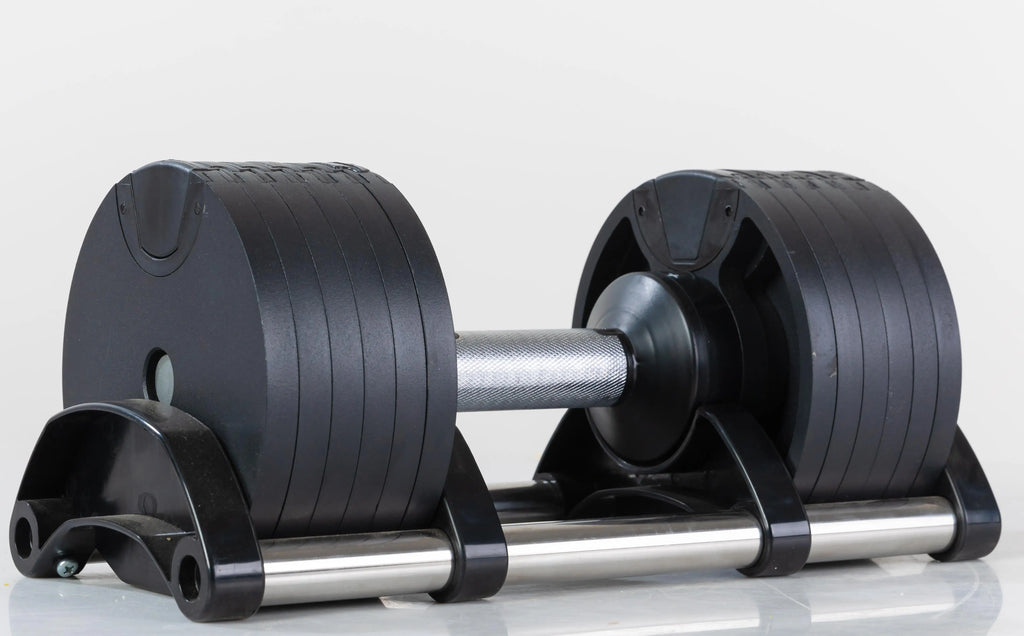 Cito Thriven adjustable cast iron dumbbells with textured handles and weight plates for strength training and fitness workouts.